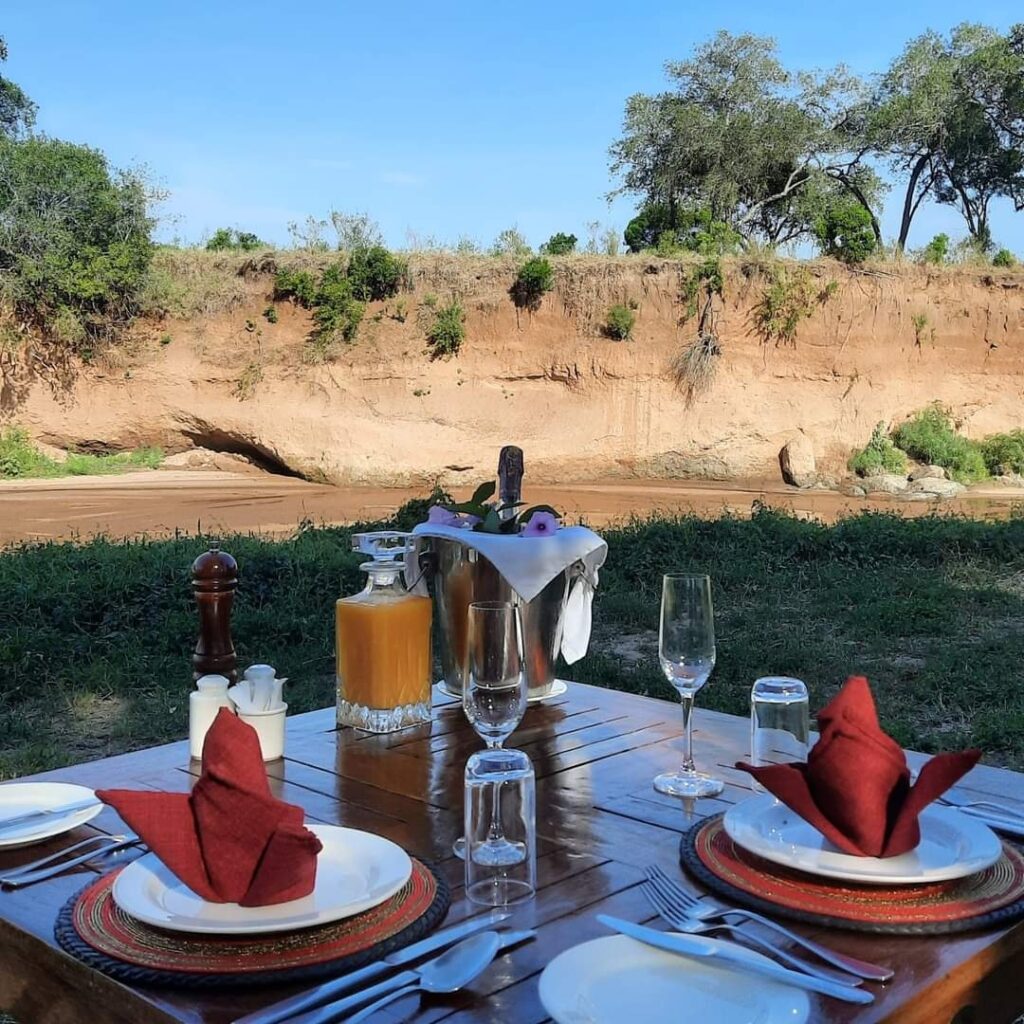 breakfast at the river at Elewana Sand River camp Masai Mara