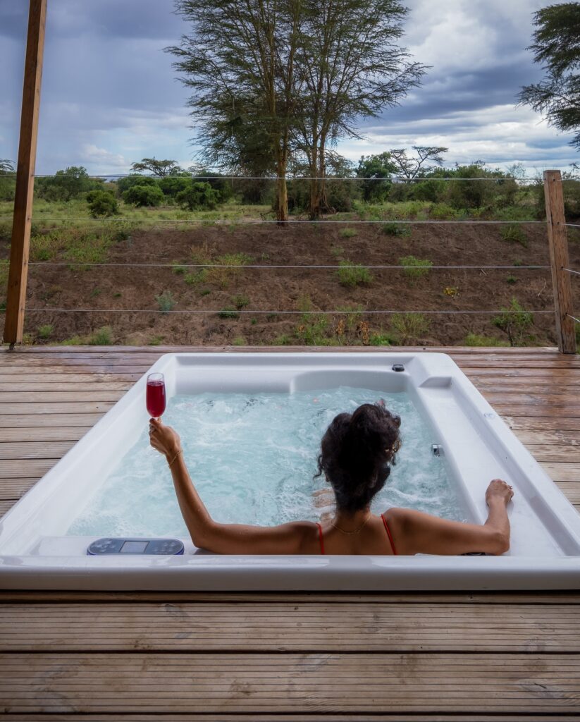 chiling in a jacuzzi with breathtaking views of masai mara from the comfort of your tent at JW Marriott Masai Mara Lodge