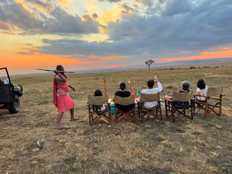 Happy guests enjoying an African sunsowner in Kenya - book Big Five Africa wildlife safaris in Kenya and Tanzania with Twinkle Star Tours & Safaris